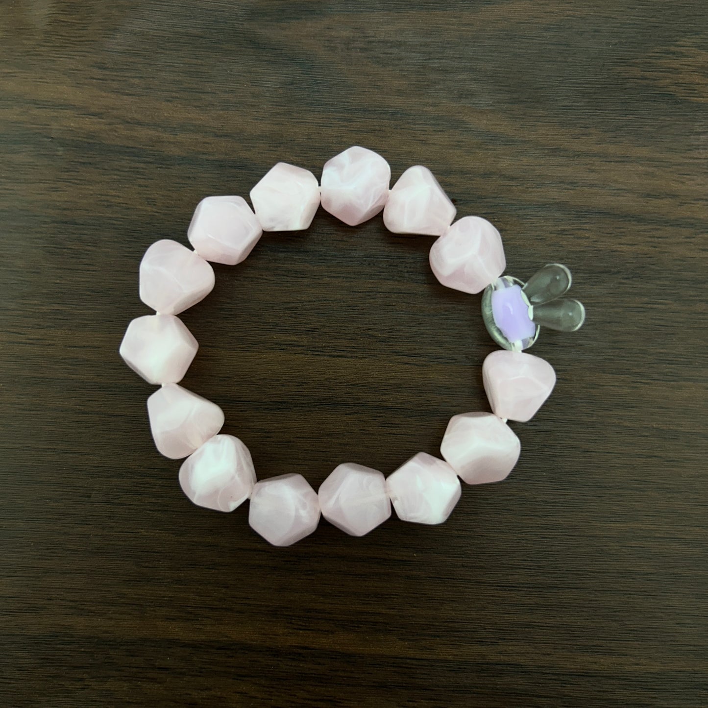 Pink beaded bracelet with a contrast bunny bead
