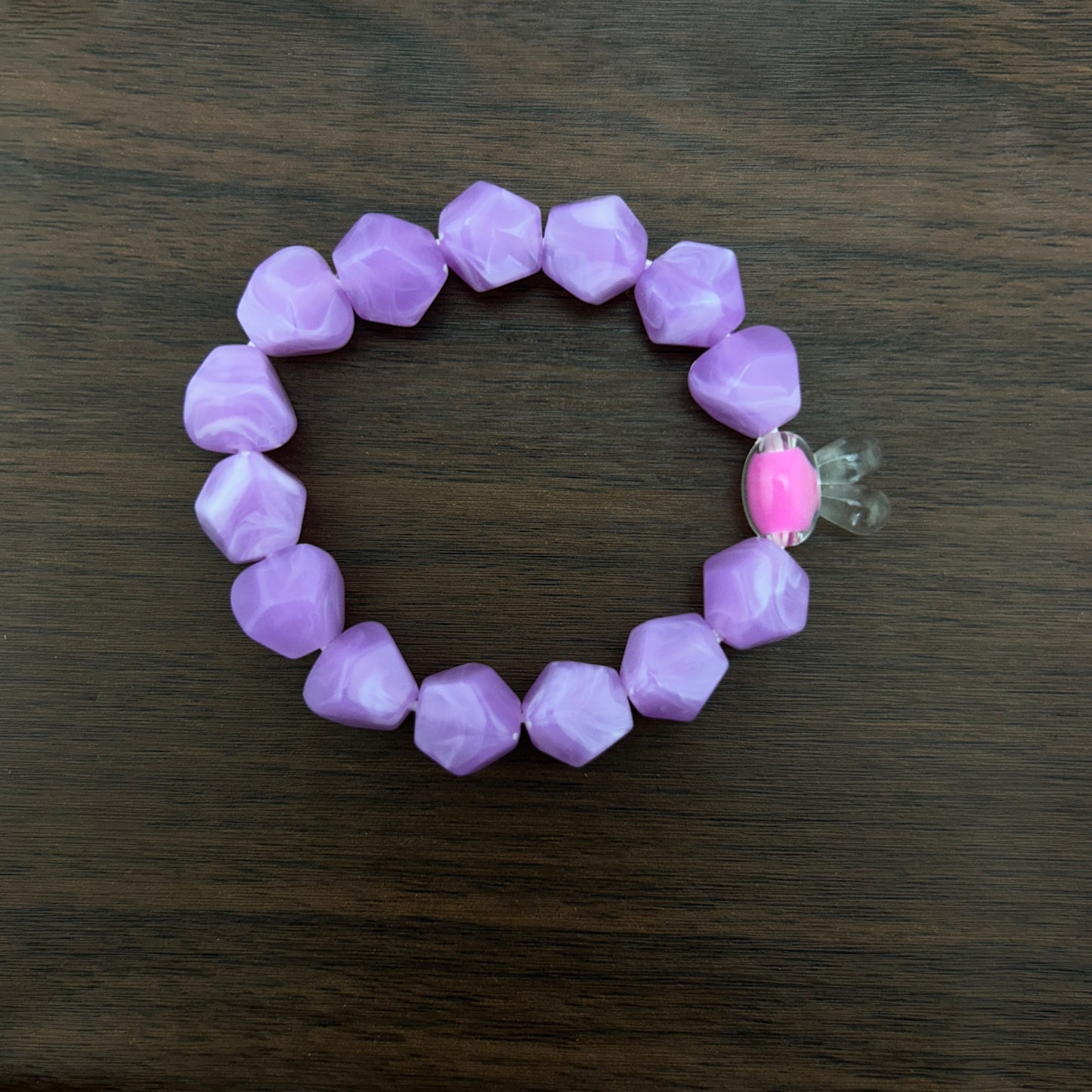 Purple beaded bracelet with a contrast bunny bead
