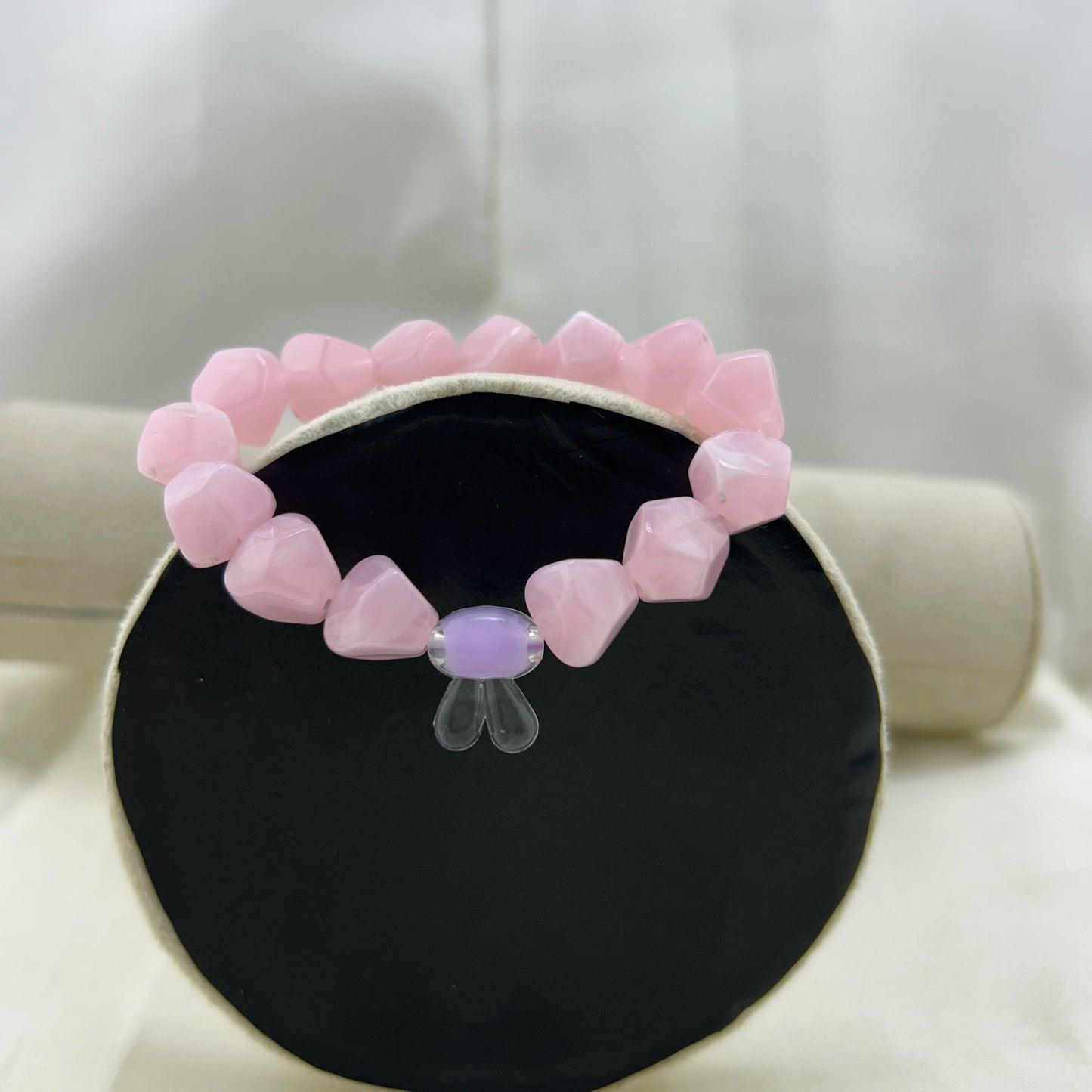 Pink beaded bracelet with a contrast bunny bead