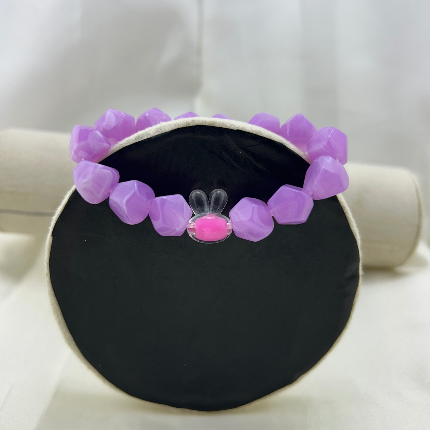 Purple beaded bracelet with a contrast bunny bead