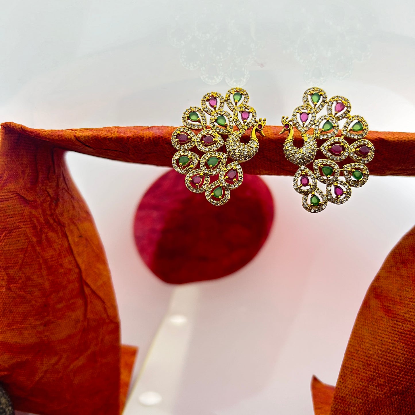 Peacock elegance statement stud - pink and green stones