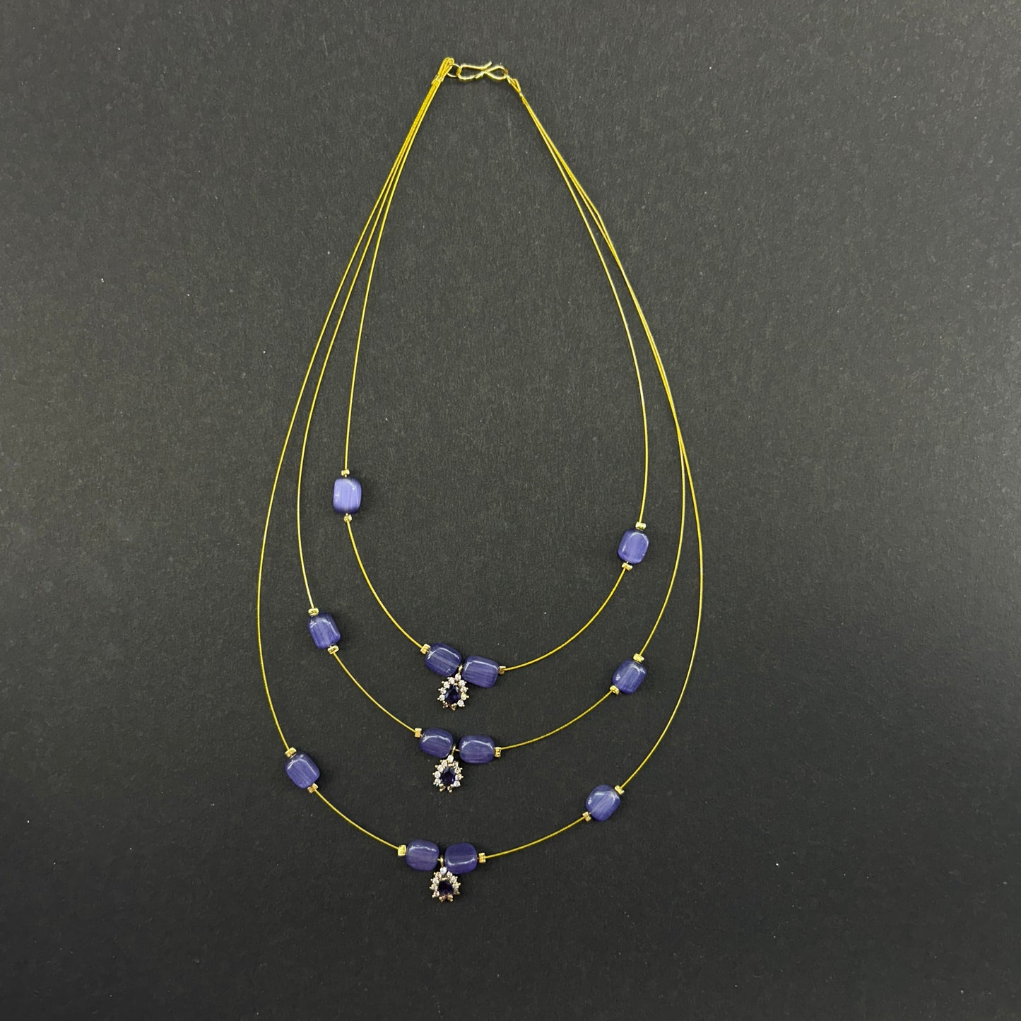 Three layered purple beaded invisible chain