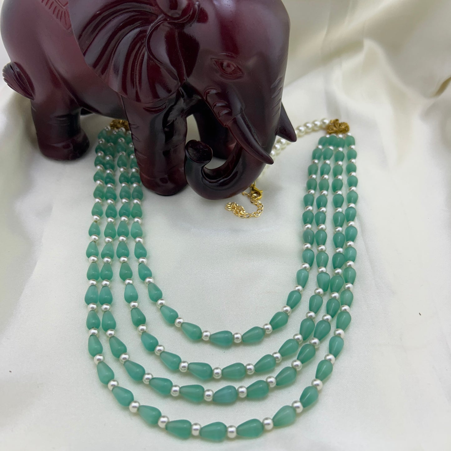 Light turquoise 4-layered Monalisa beaded necklace