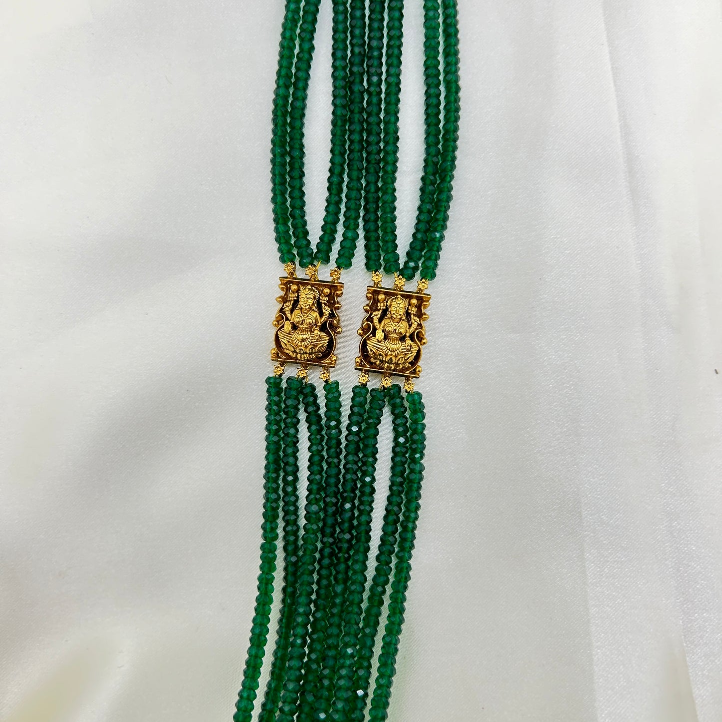 Long necklace with green semiprecious beads and Lakshmi pendants