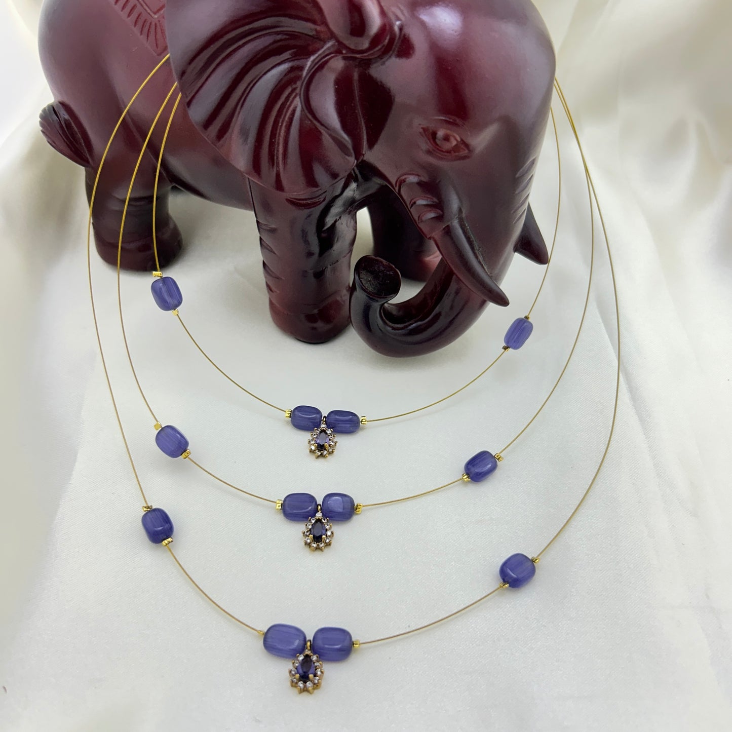 Three layered purple beaded invisible chain