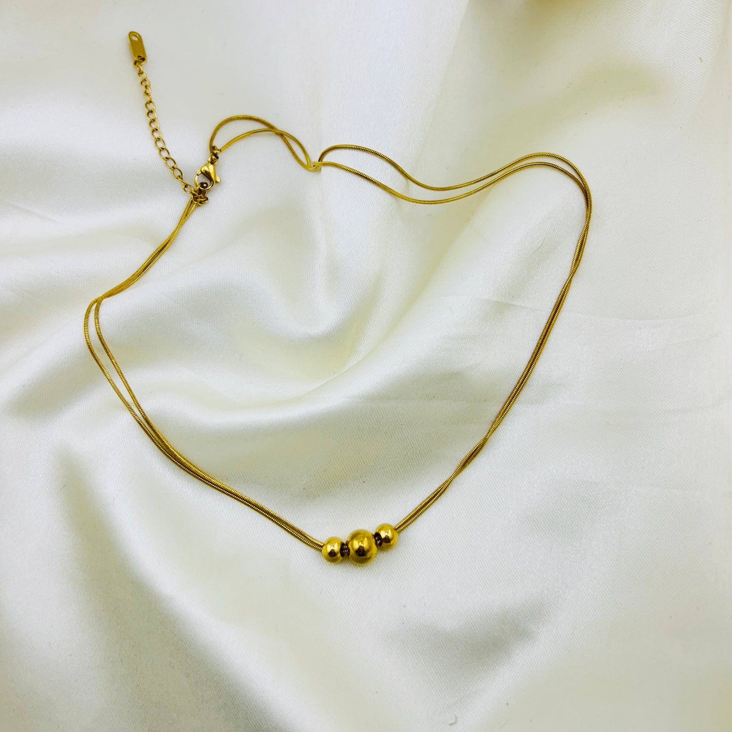 Three gold beaded two layer demifine necklace