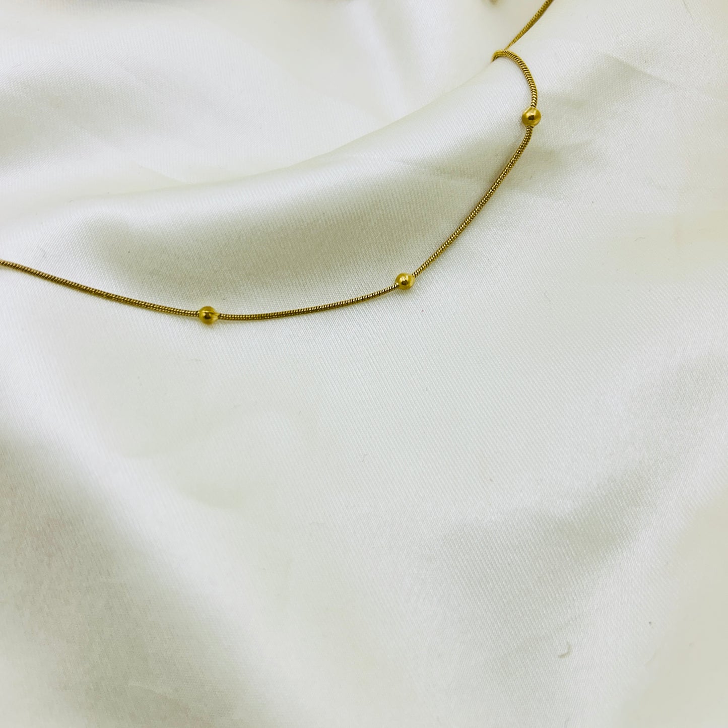 Single layer tiny golden beaded thin demifine necklace
