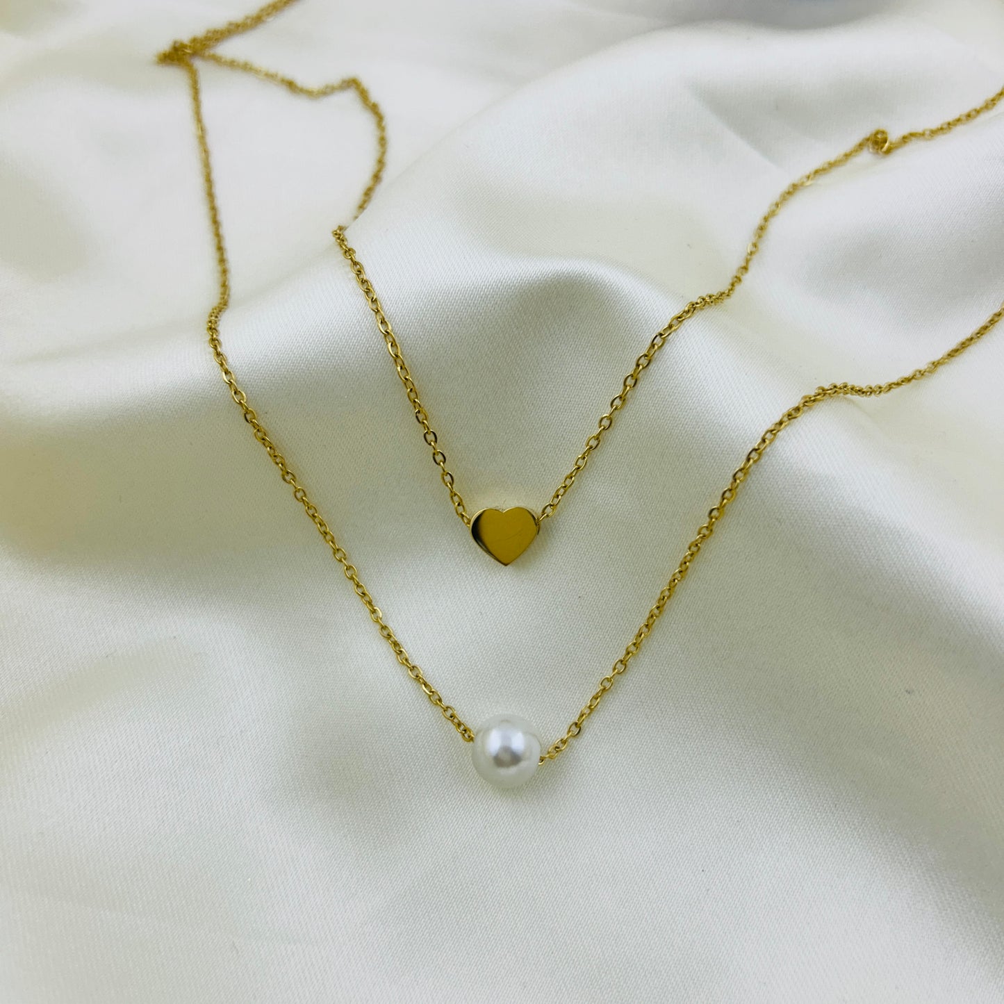 Two layer heart and a pearl demifine necklace