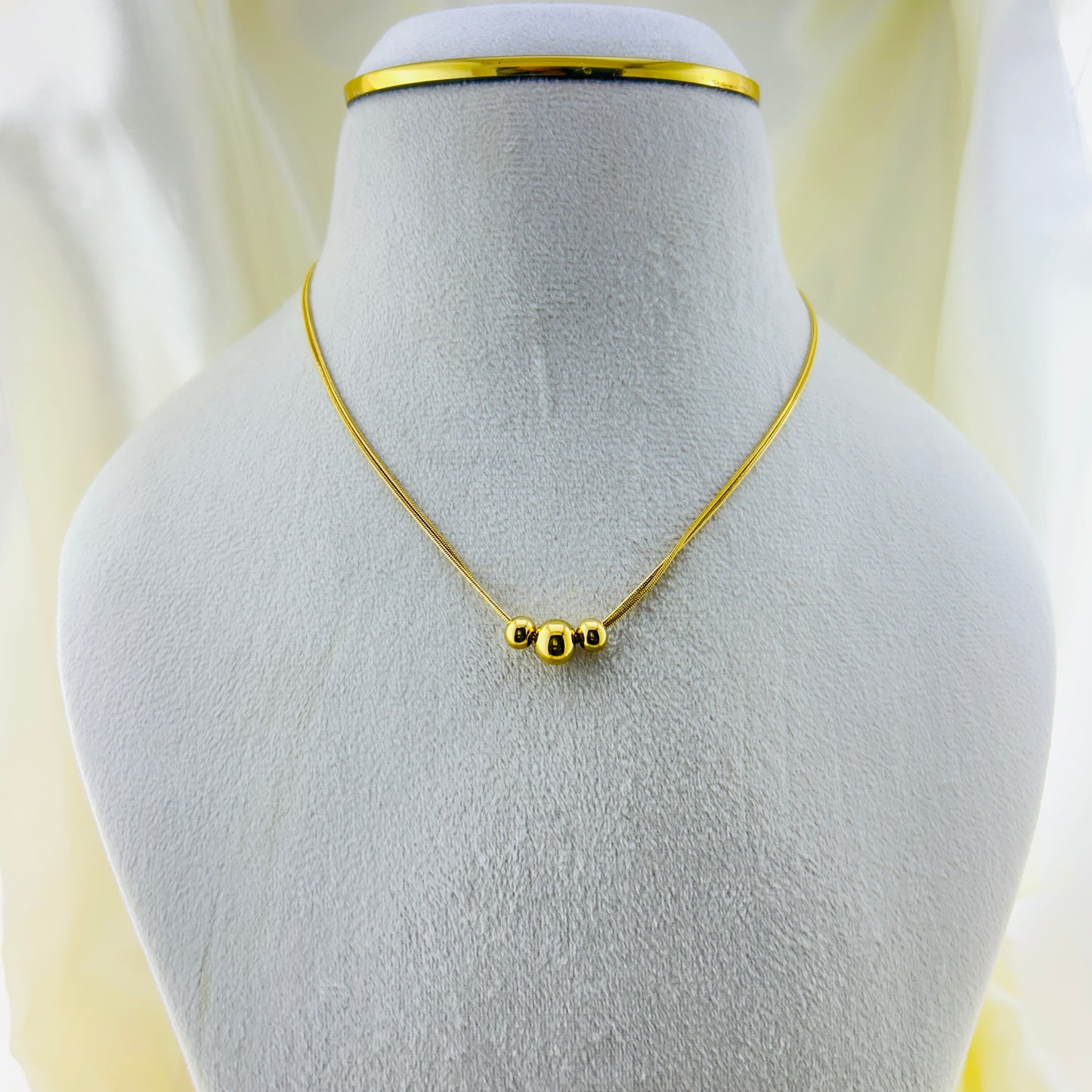 Three gold beaded two layer demifine necklace