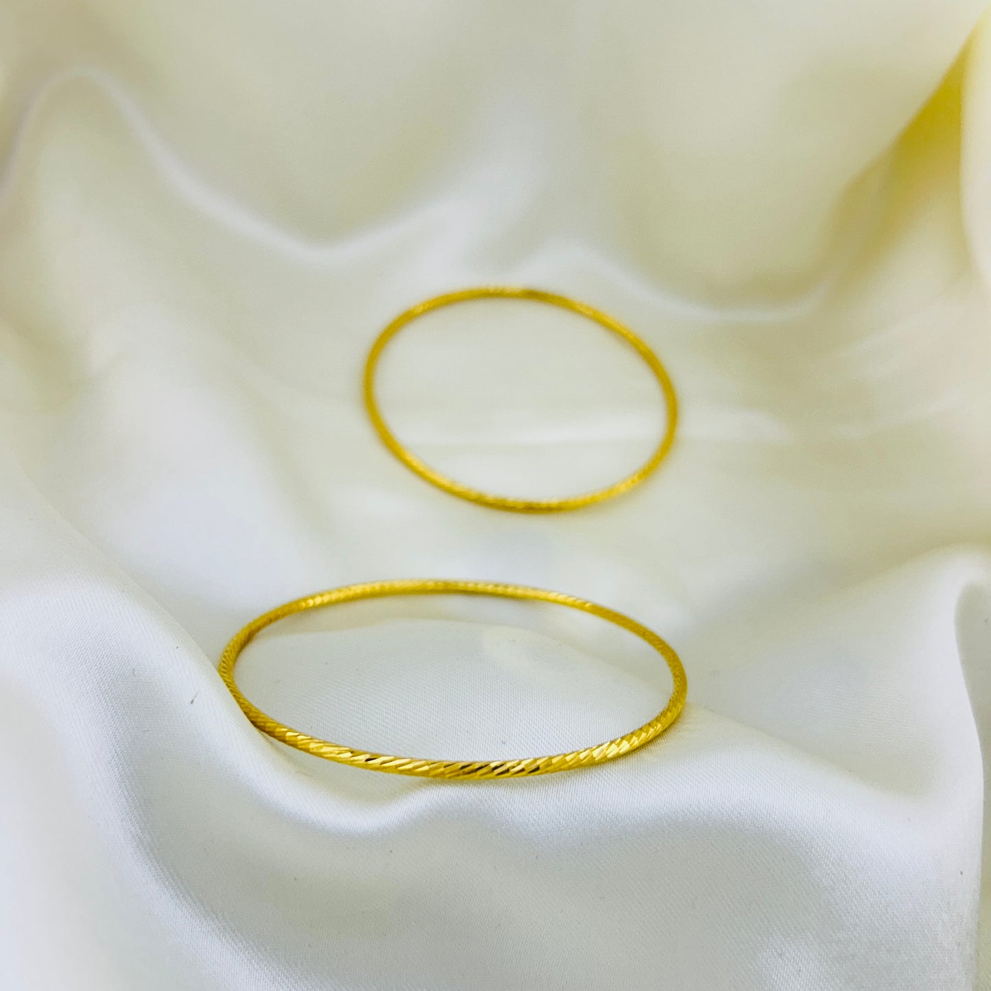 Simple and round golden bangles