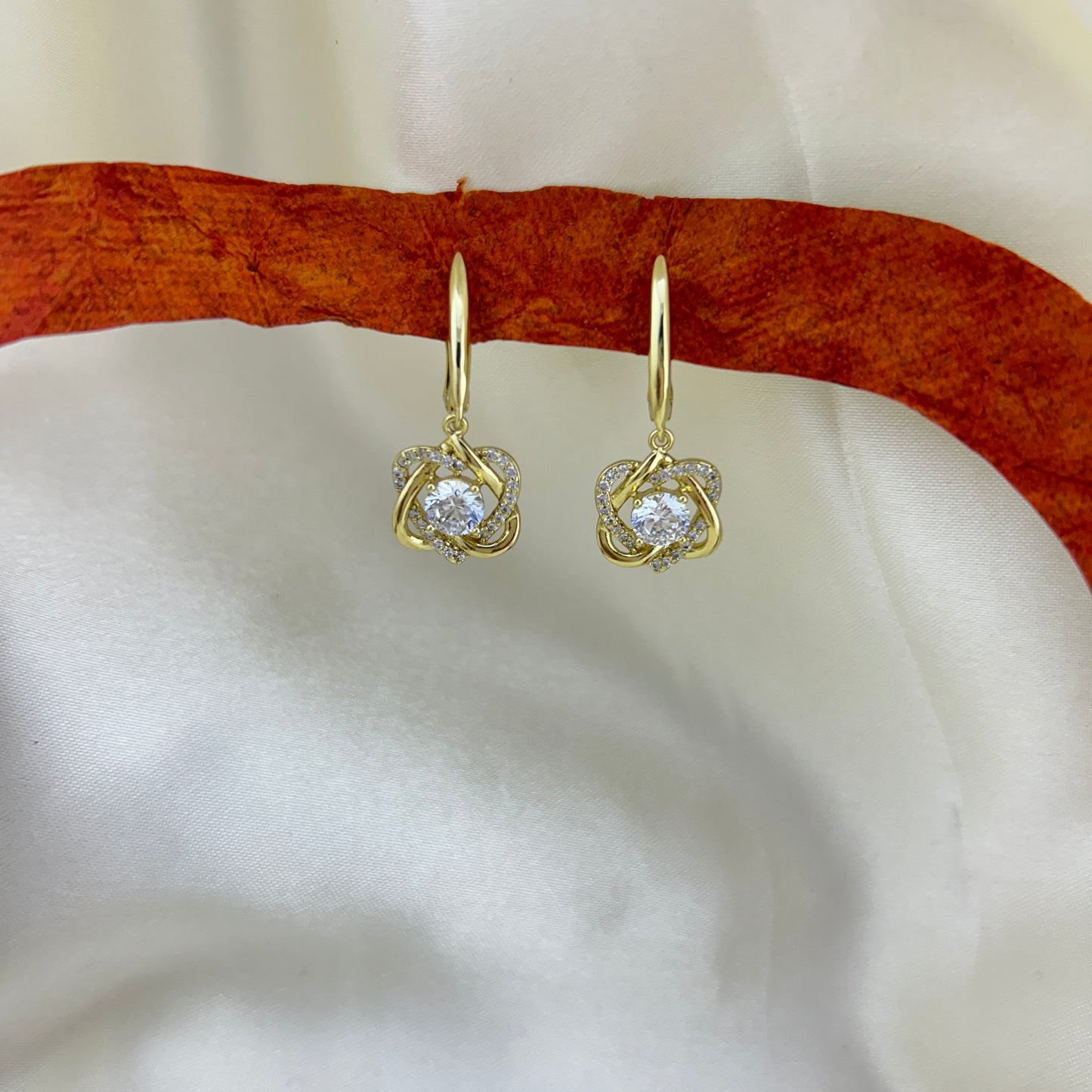 Twisted hearts, sparkling stone dangle hoops - zirconia cluster drop earrings