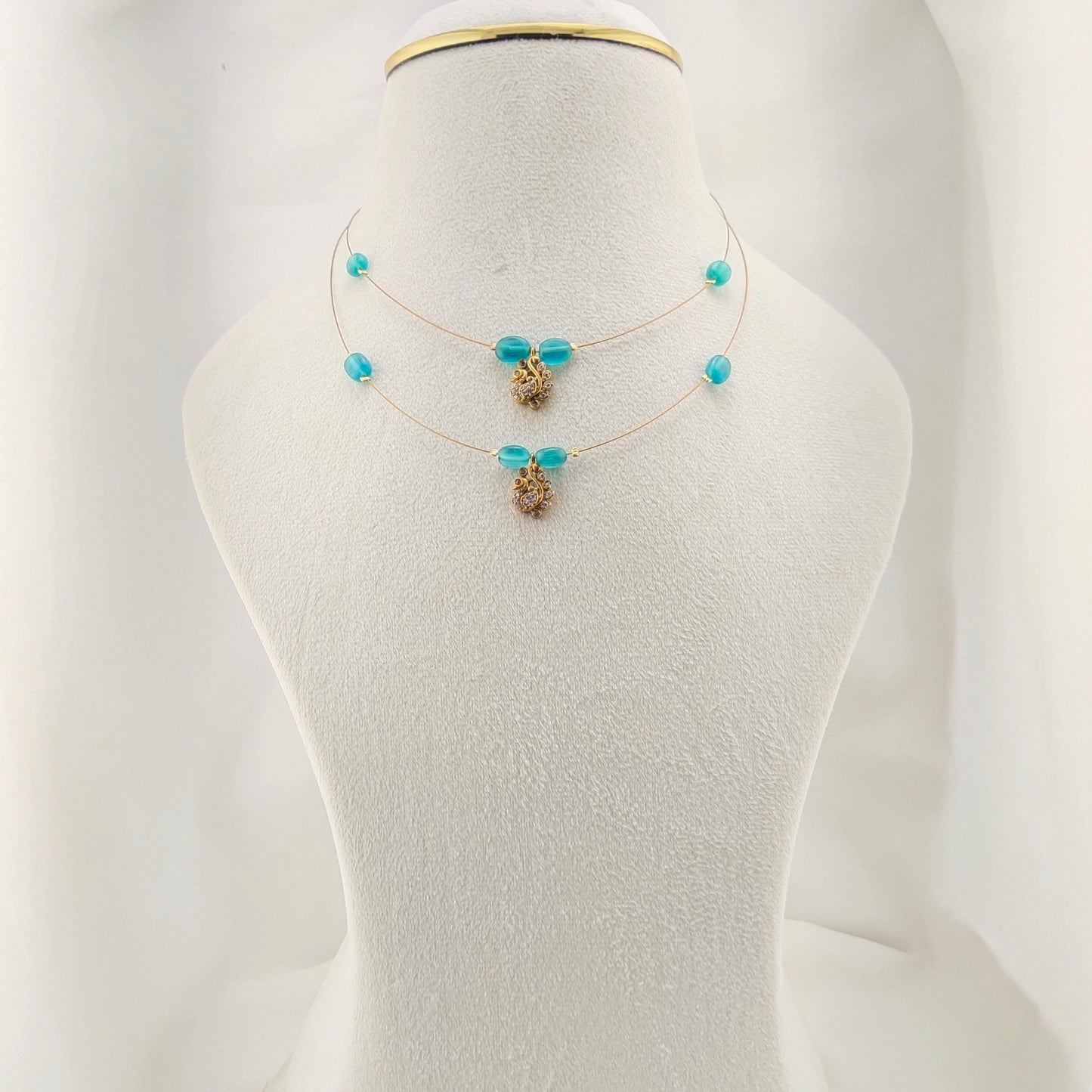 Two layered pacock green beaded invisible chain