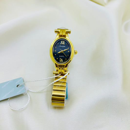 Gold wristwatch with a black face on a white background