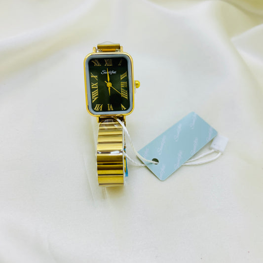 Gold watch with a olive green face on a white surface.