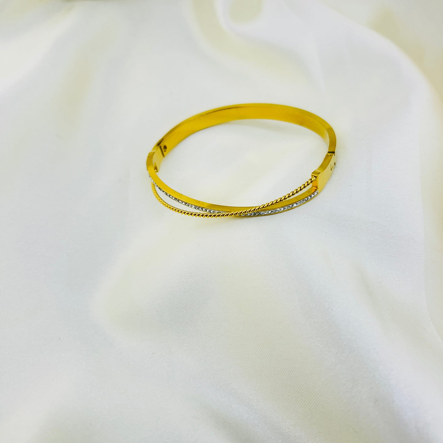 Demi-fine gold bracelet with dual line twist design
