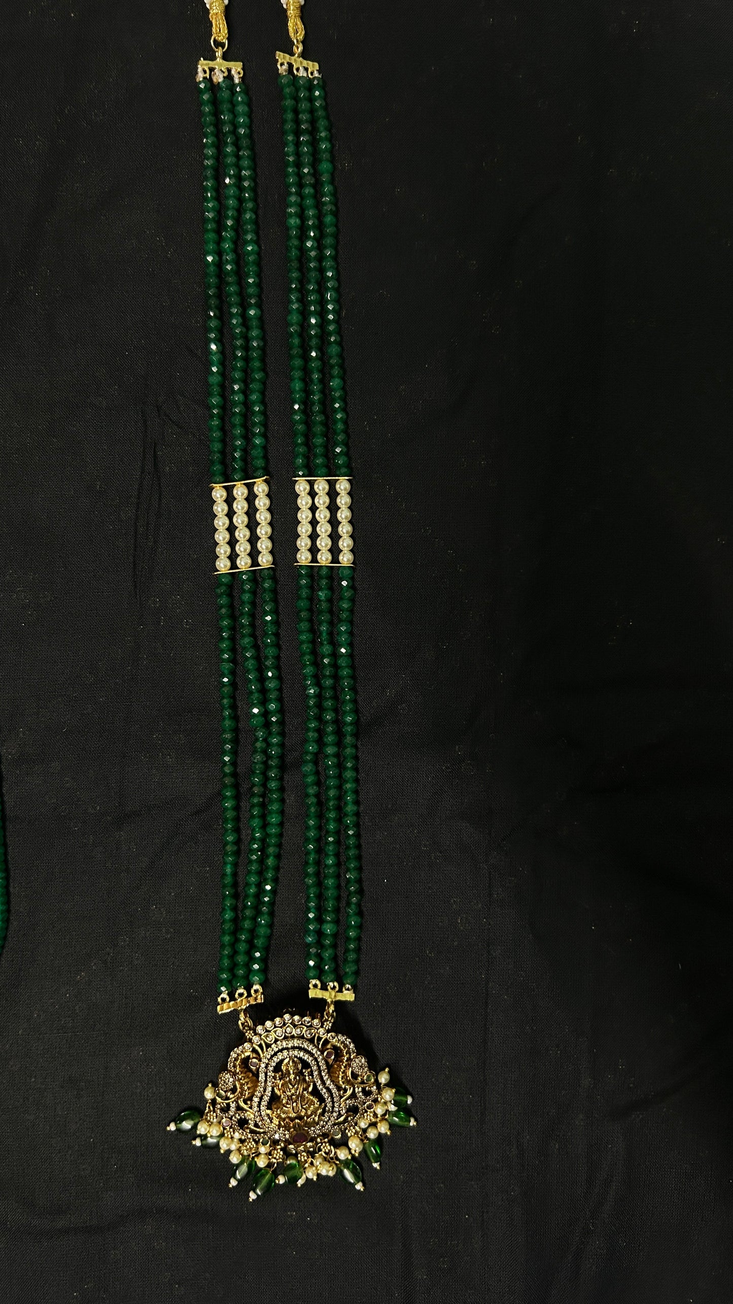 Long necklace with green semiprecious beads, pearls and Lakshmi pendant