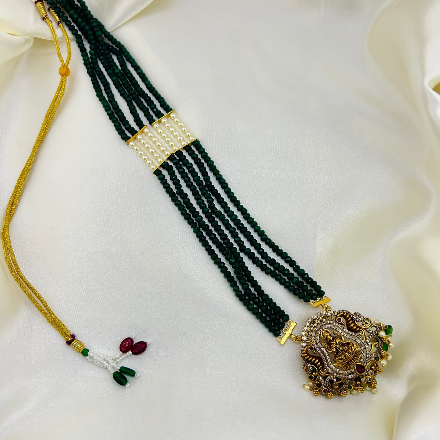 Long necklace with green semiprecious beads, pearls and Lakshmi pendant