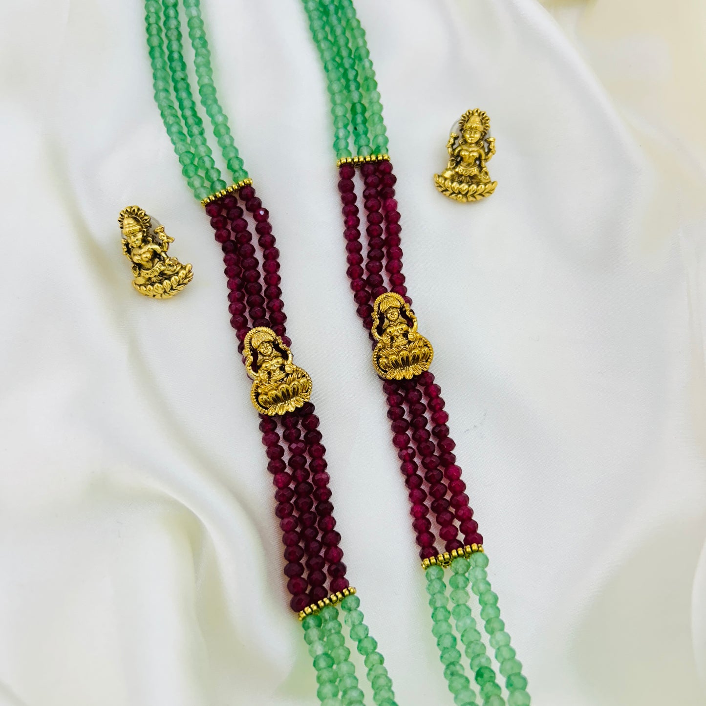 Long necklace with light green and pink semiprecious beads and Lakshmi pendants with earrings