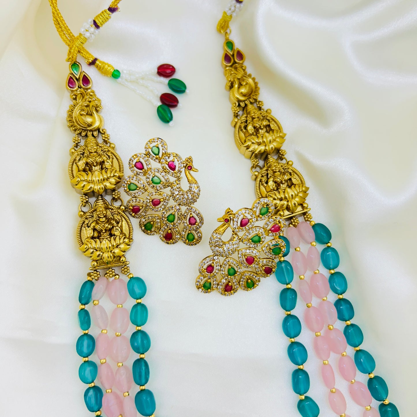 Gold necklace with green and pink beads