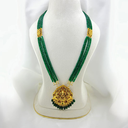 Long necklace with green semiprecious beads and Lakshmi pendants
