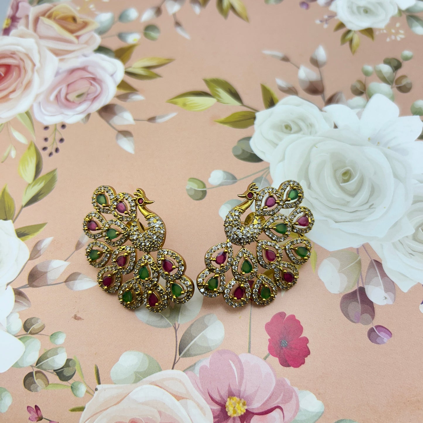 Peacock elegance statement stud - pink and green stones