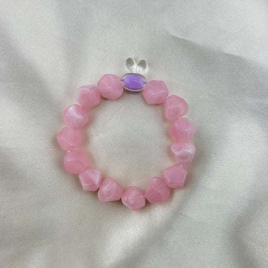 Pink beaded bracelet with a contrast bunny bead