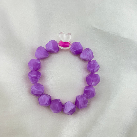Purple beaded bracelet with a contrast bunny bead