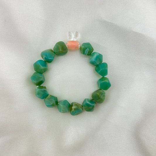 Green beaded bracelet with a contrast bunny bead
