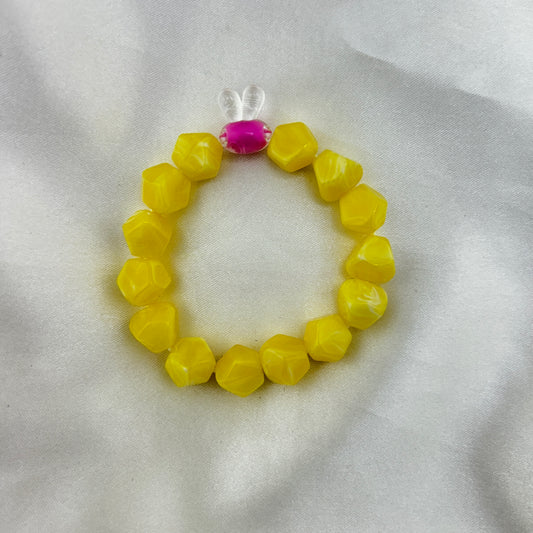 Yellow beaded bracelet with a contrast bunny bead