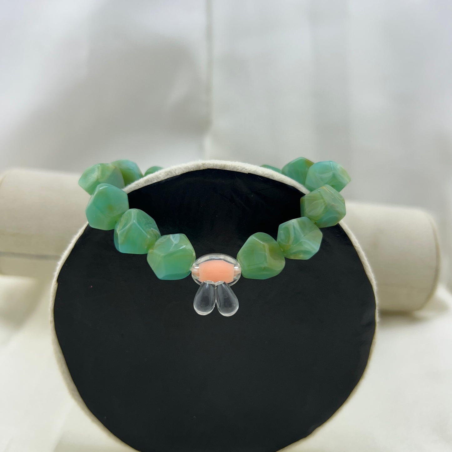 Green beaded bracelet with a contrast bunny bead