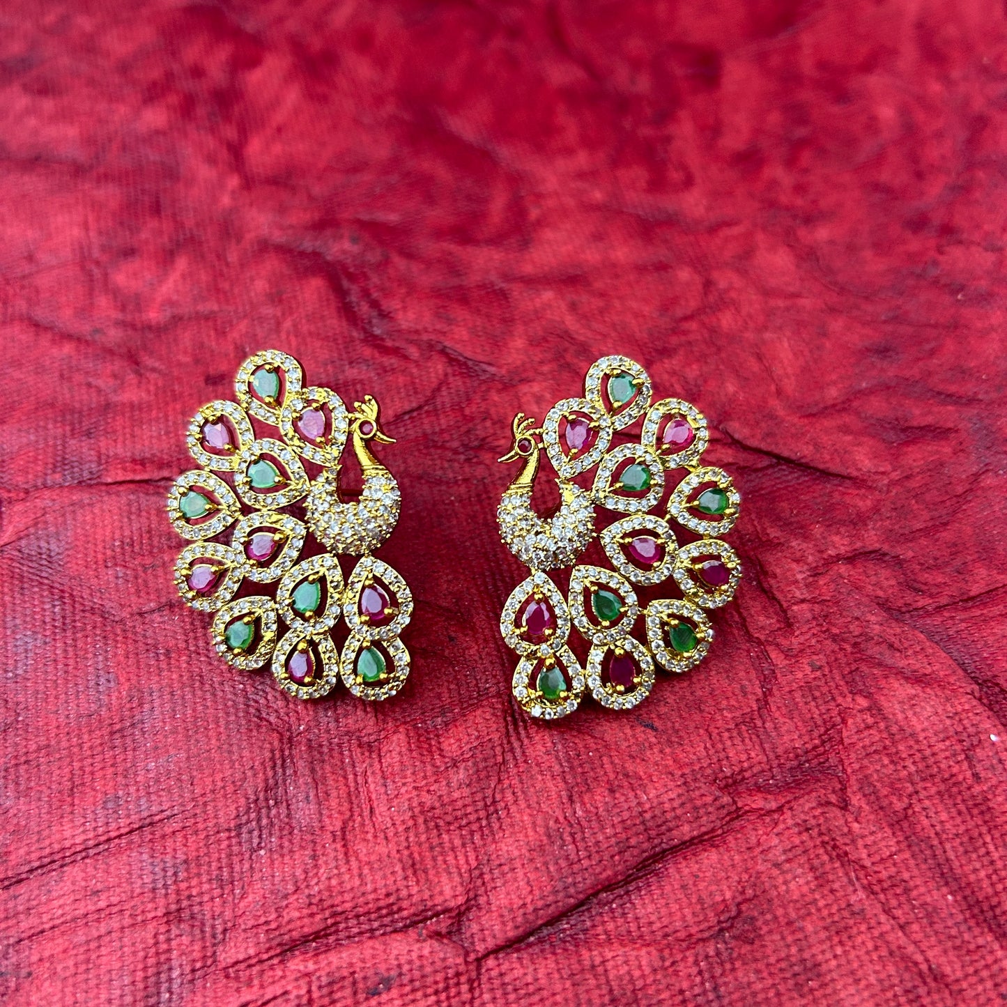 Peacock elegance statement stud - pink and green stones