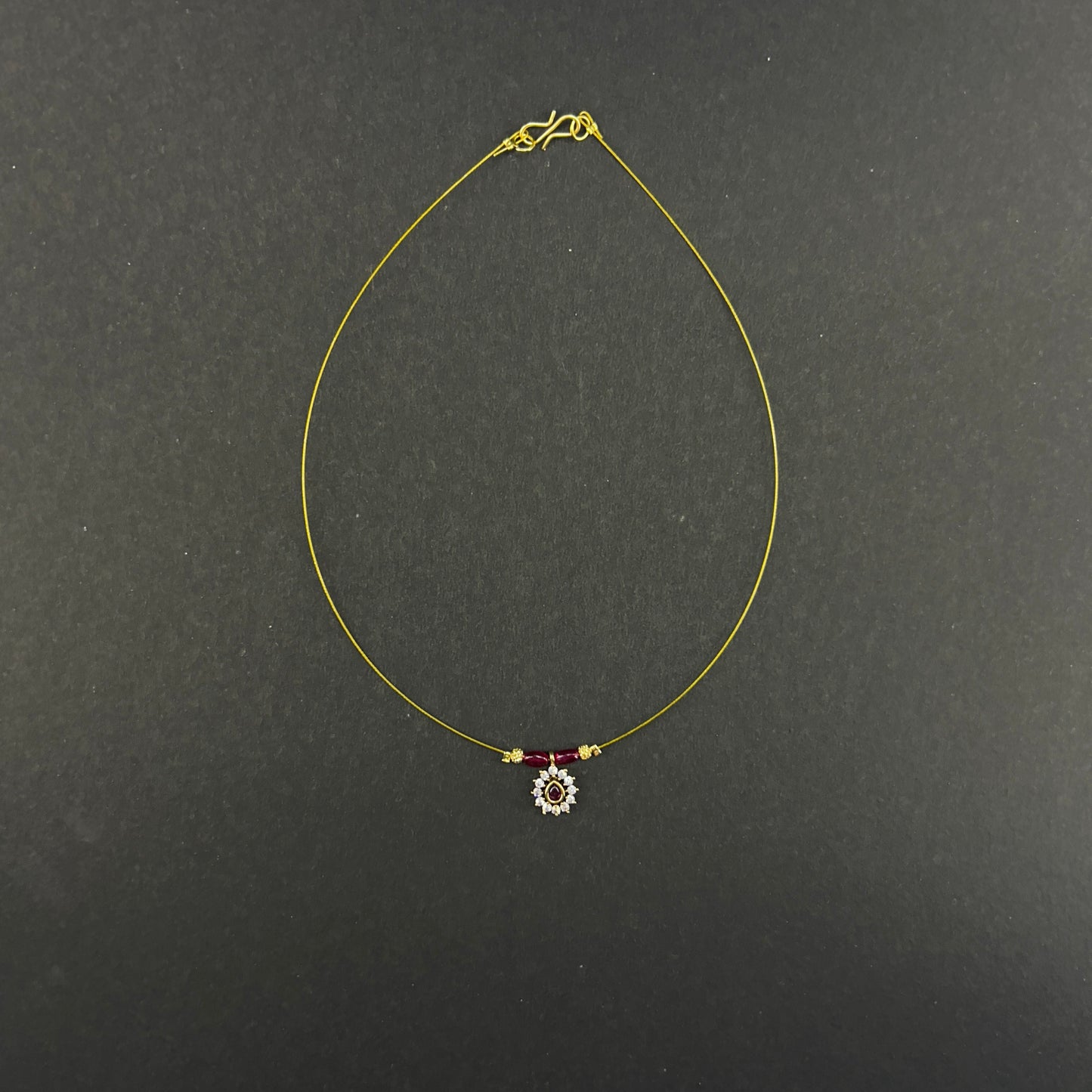 Ruby beaded oval pendant invisible chain