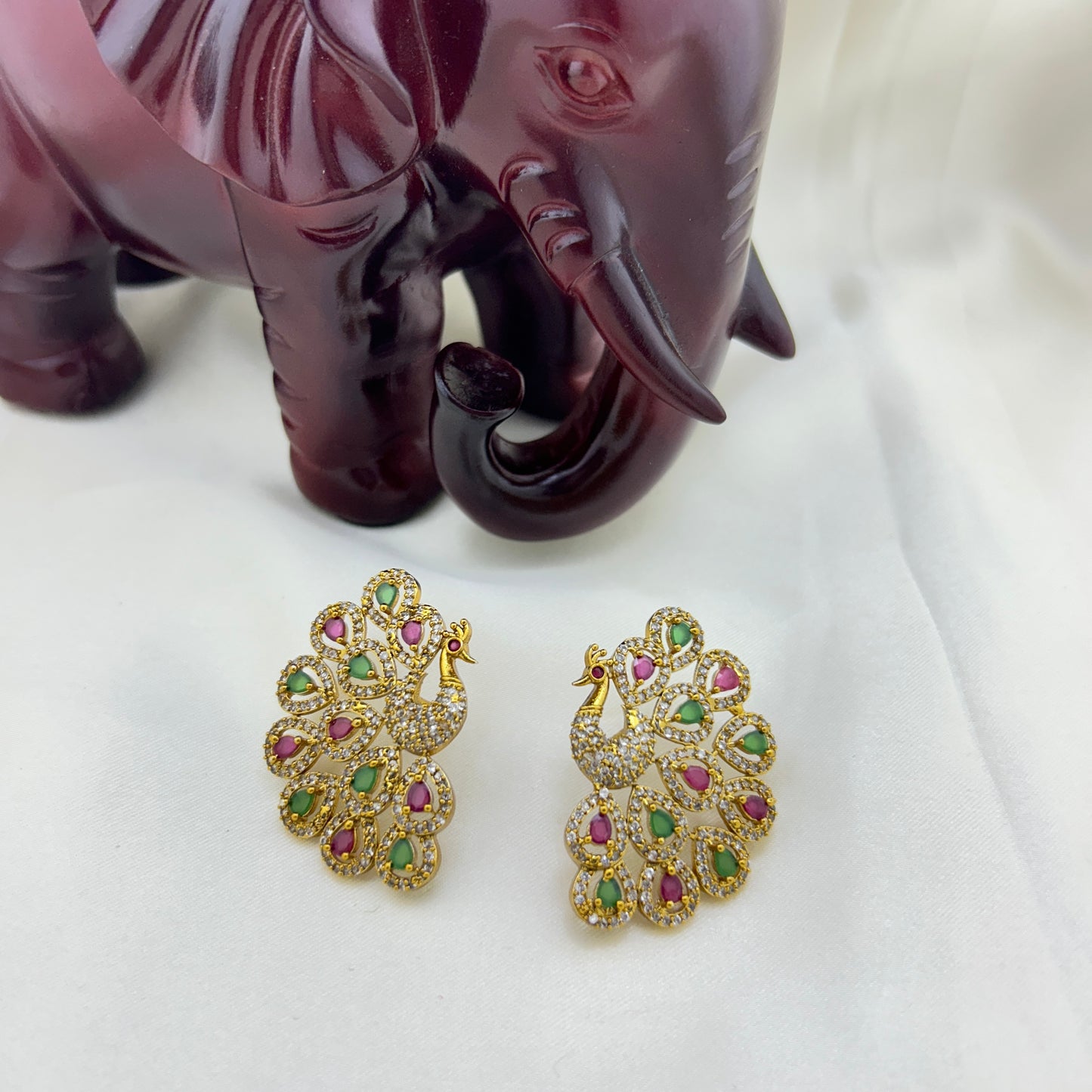 Peacock elegance statement stud - pink and green stones