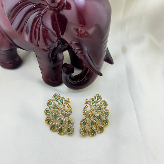 Peacock elegance statement stud - green stones