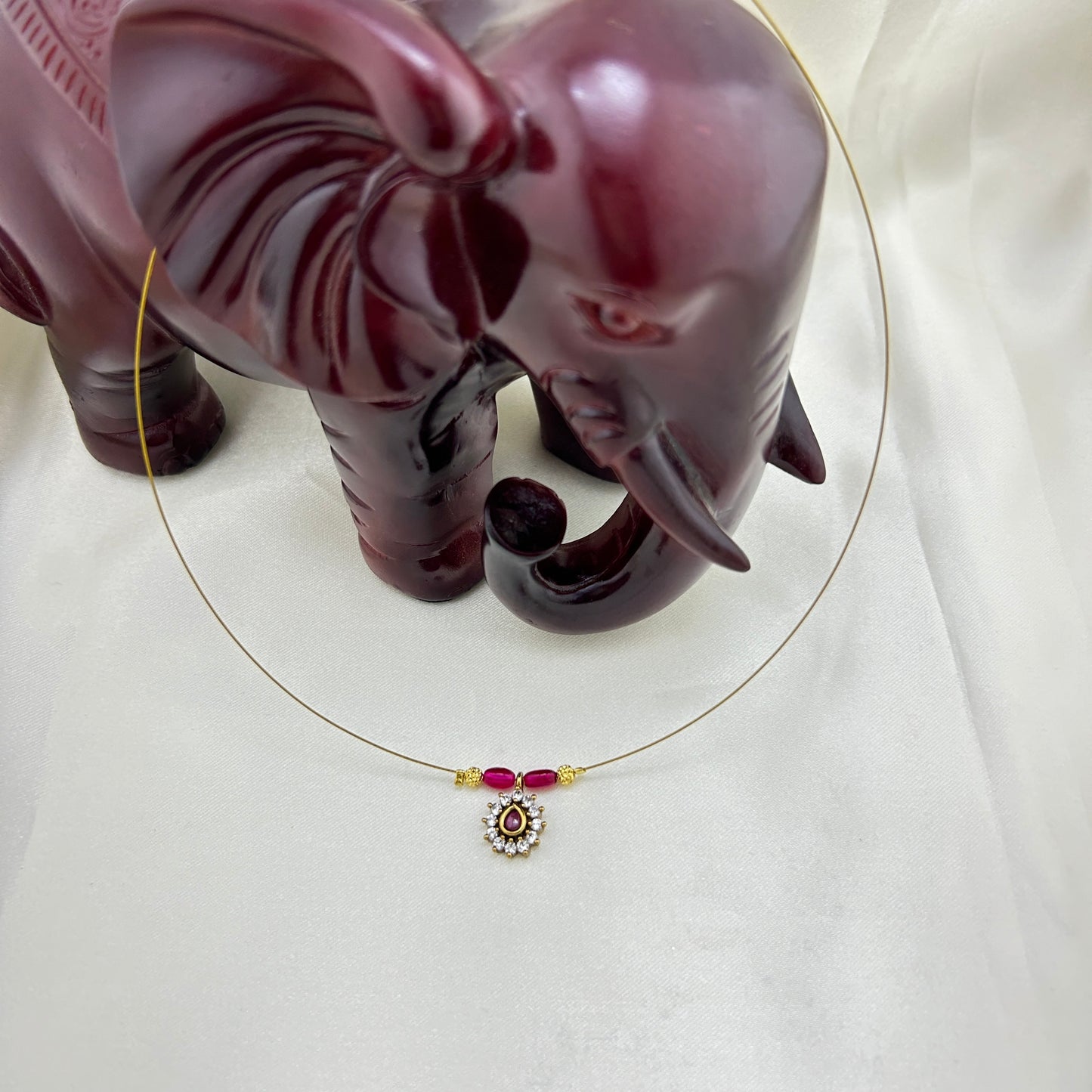 Ruby beaded oval pendant invisible chain