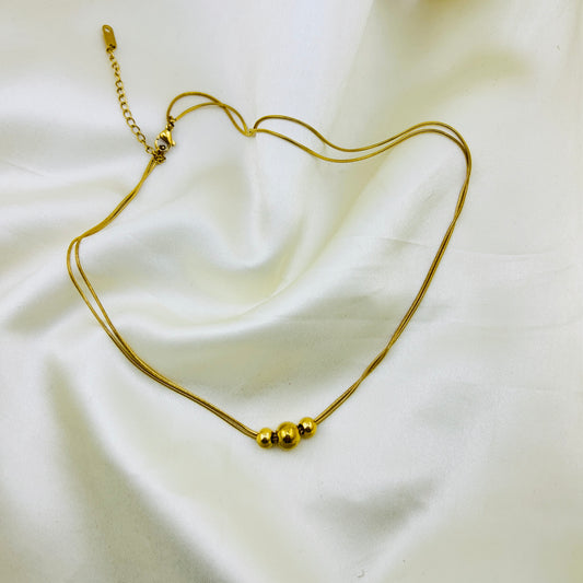 Three gold beaded two layer demifine necklace