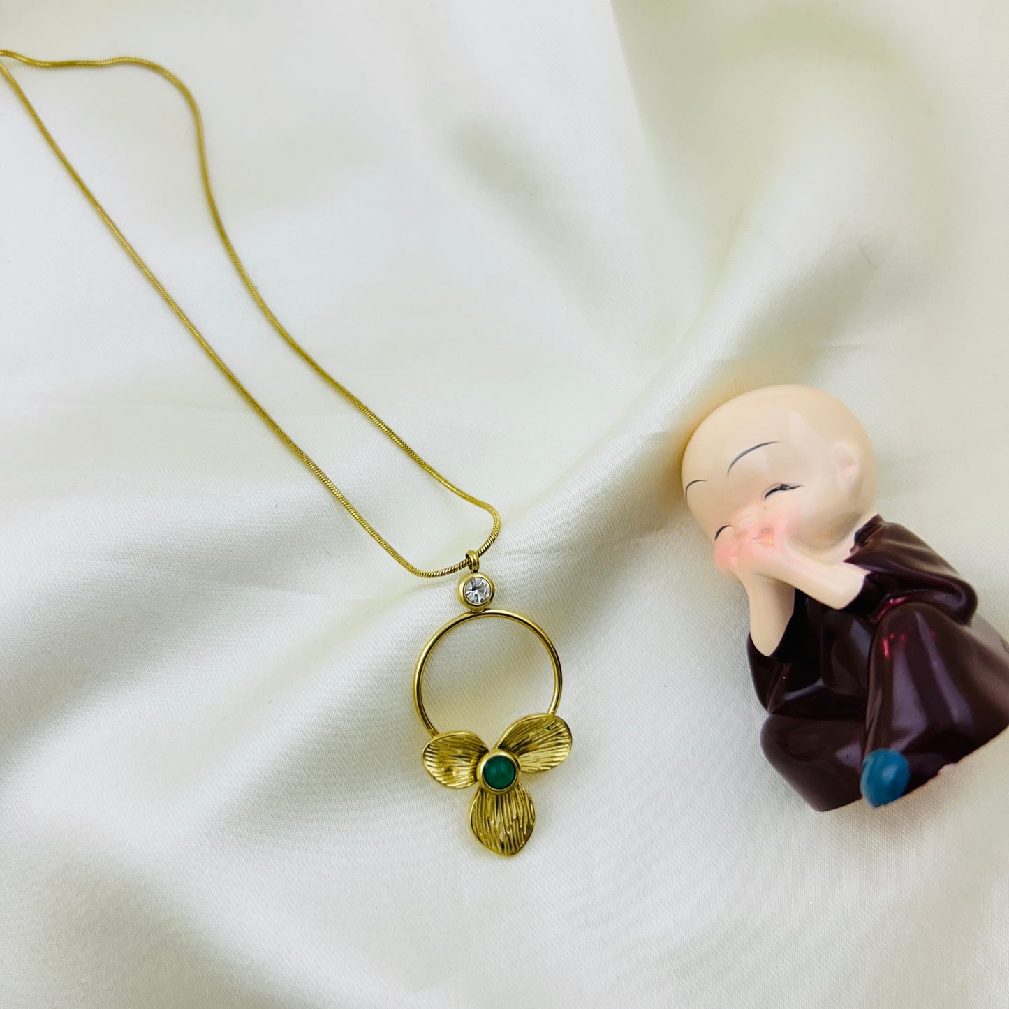 Three petal flower with a green stone at centre pendant demifine necklace