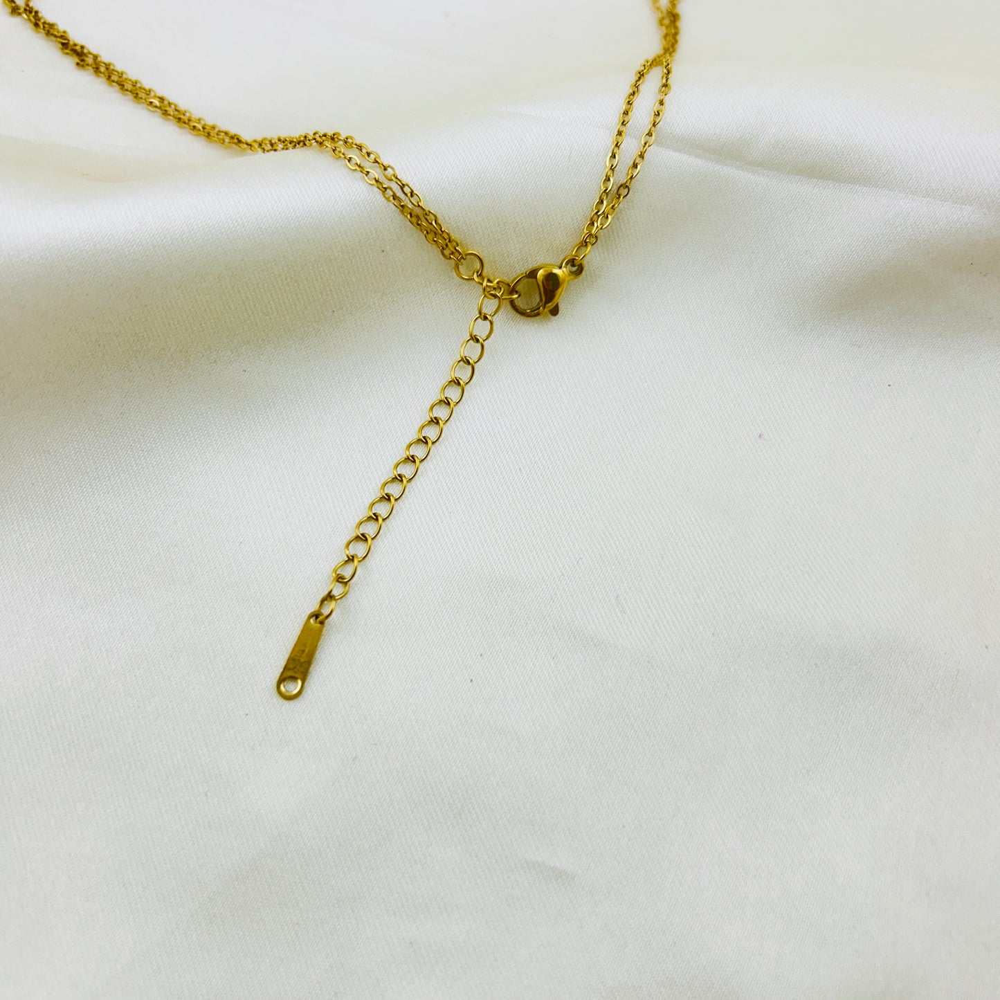 Two layered round stone with a gold drop demifine necklace