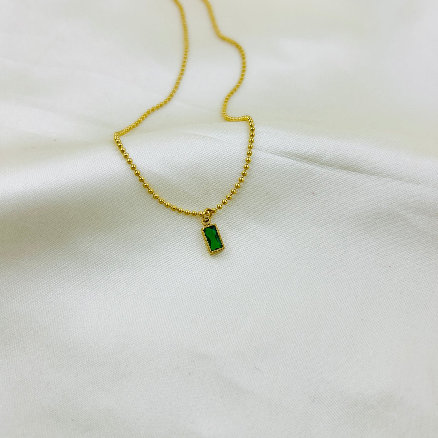 Tiny emerald green pendant with dotted chain demifine necklace