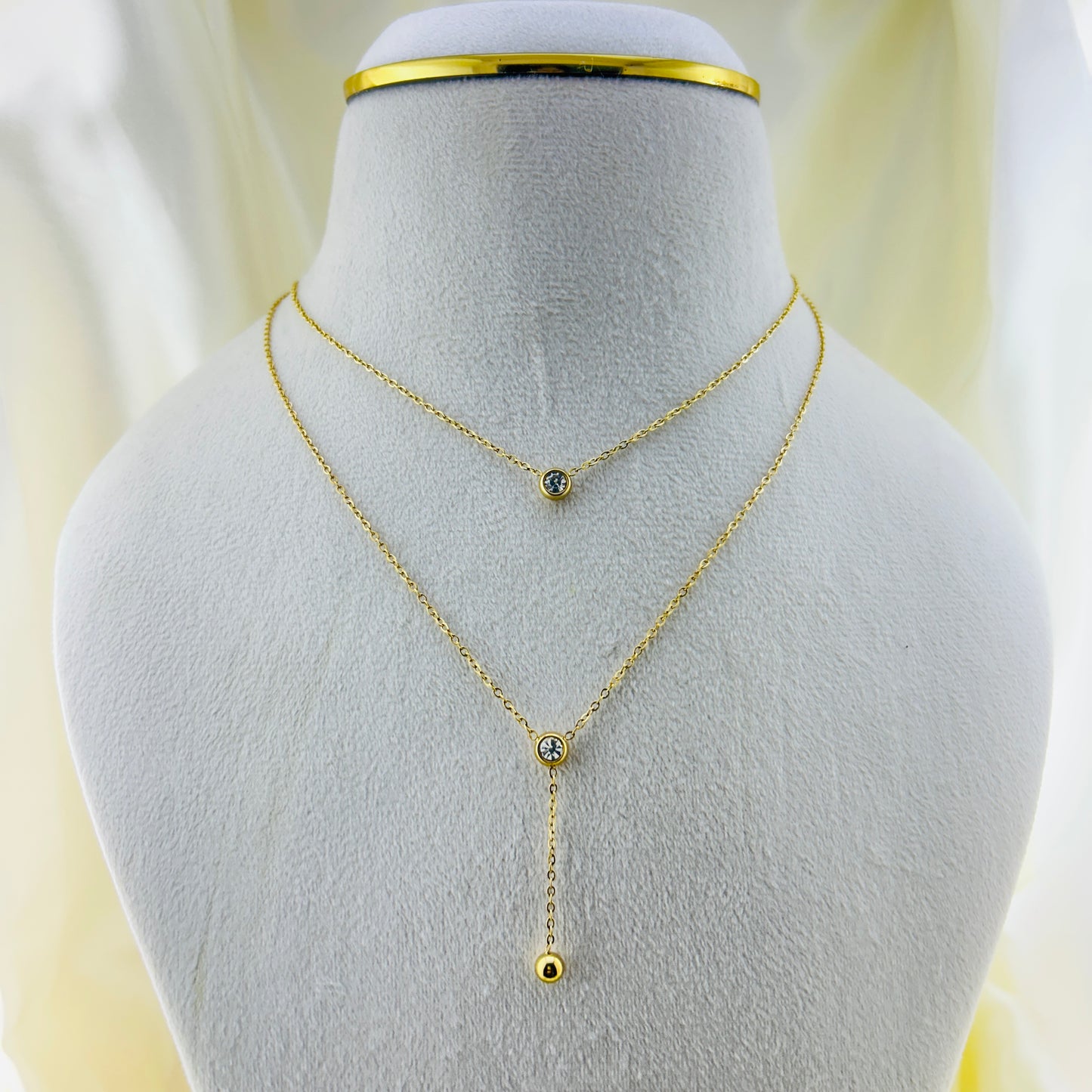 Two layered round stone with a gold drop demifine necklace