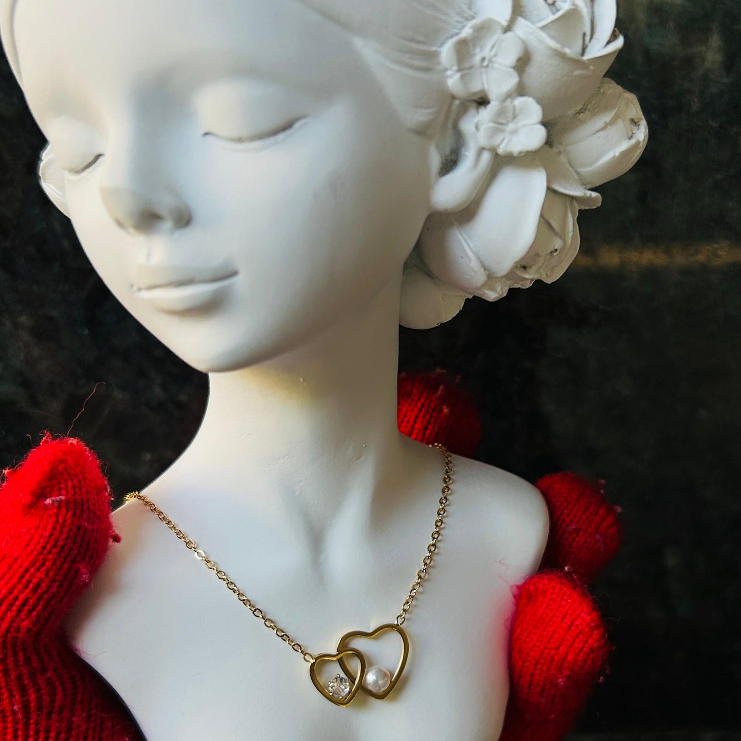 gold necklace against a dark background